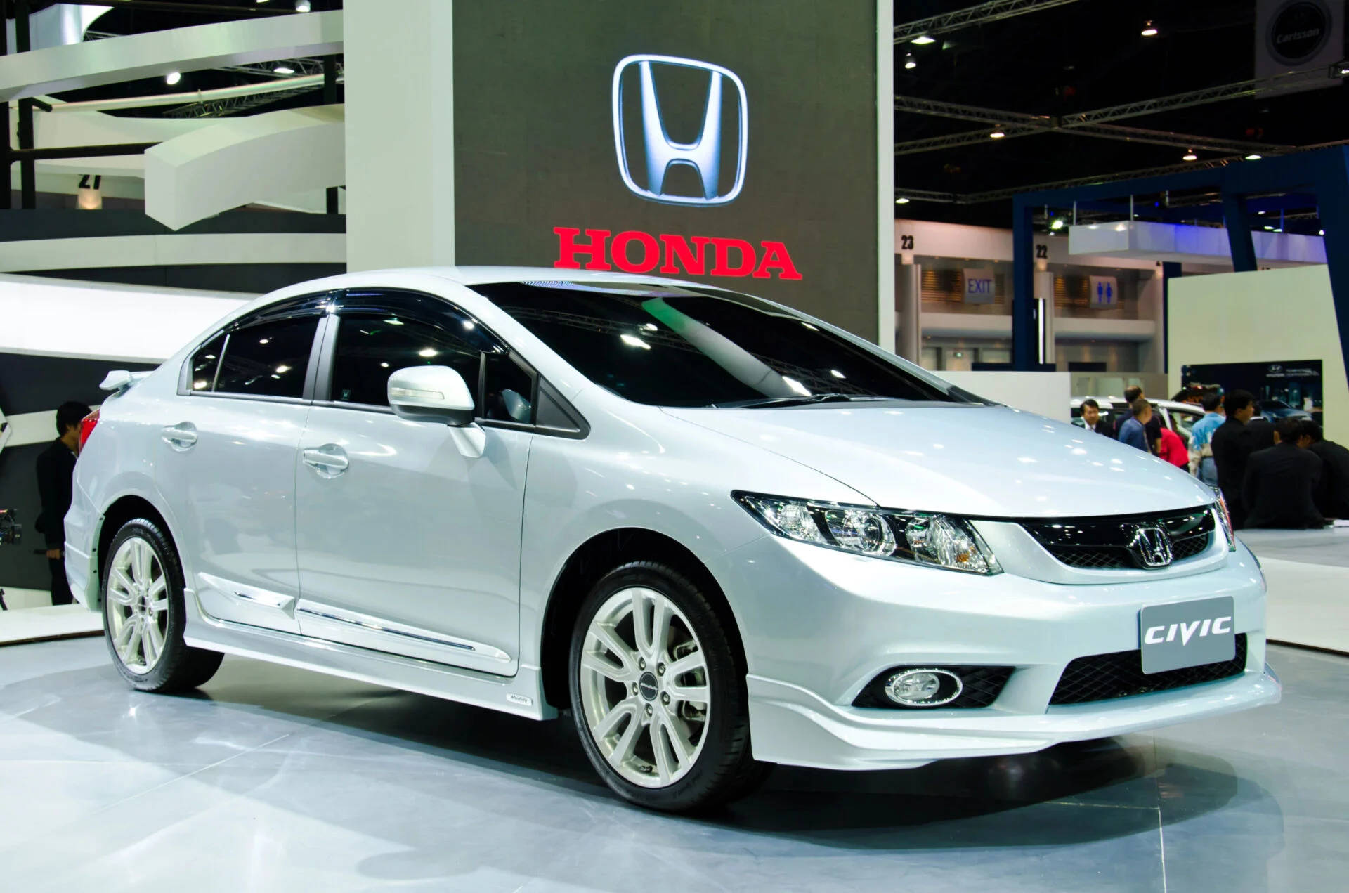 Silver Honda Civic in showroom.