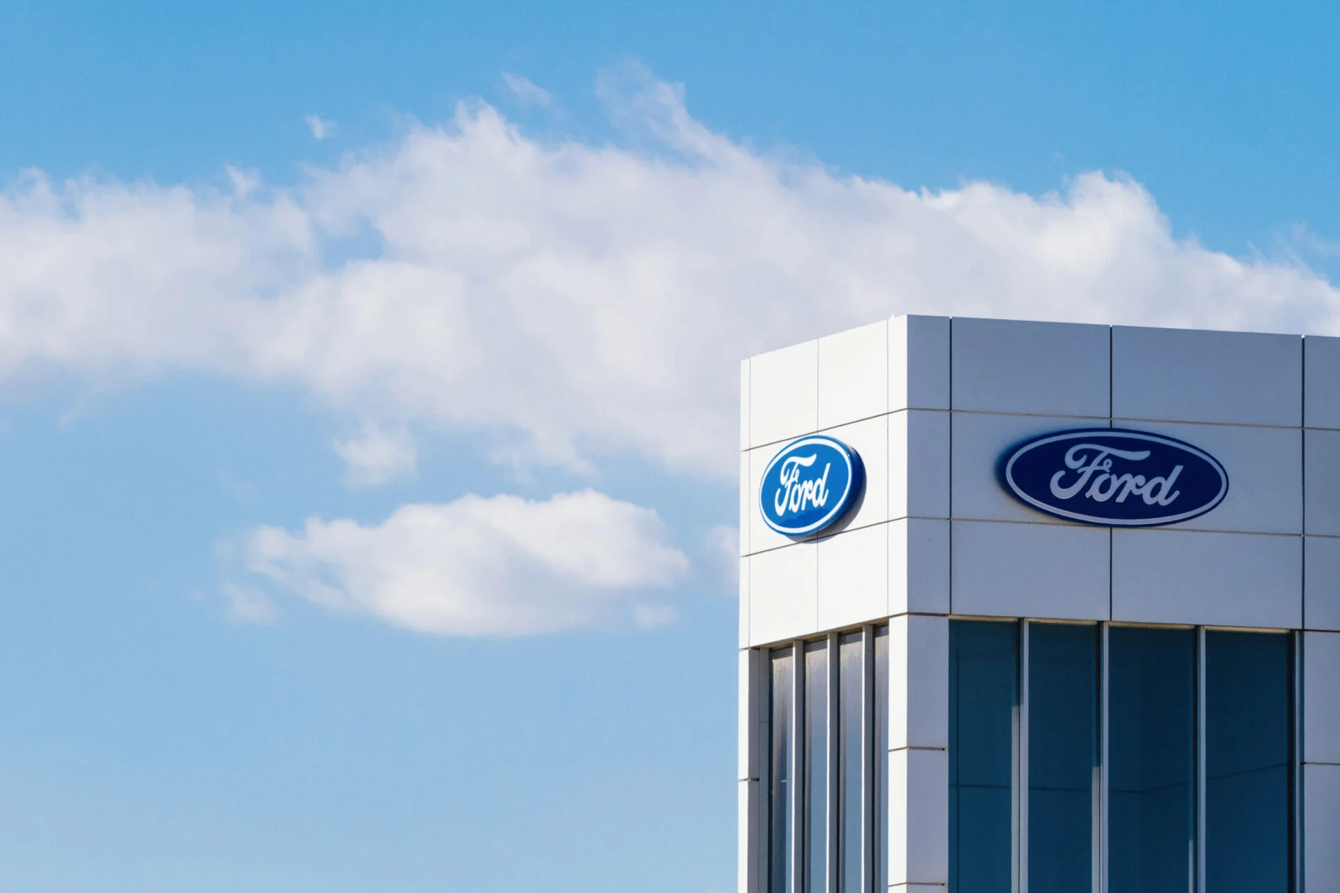 Ford logo on building.