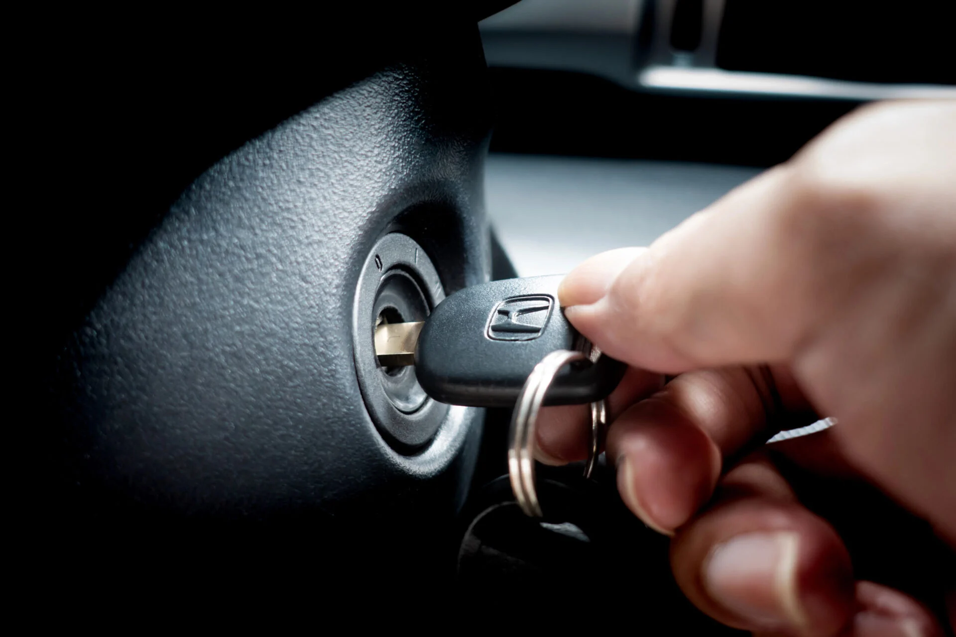 Turning the ignition of a car with the key