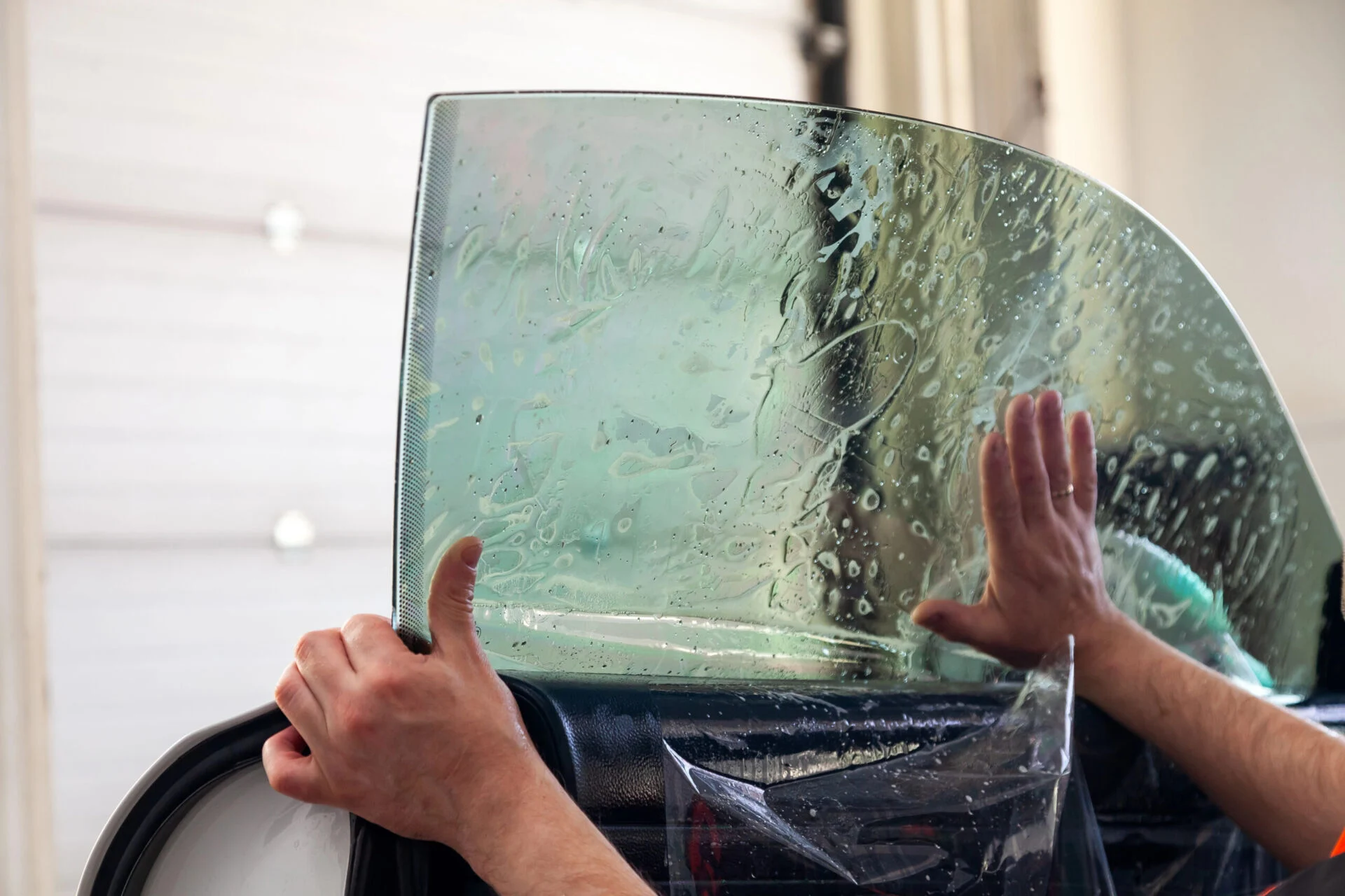 Person tinting car window