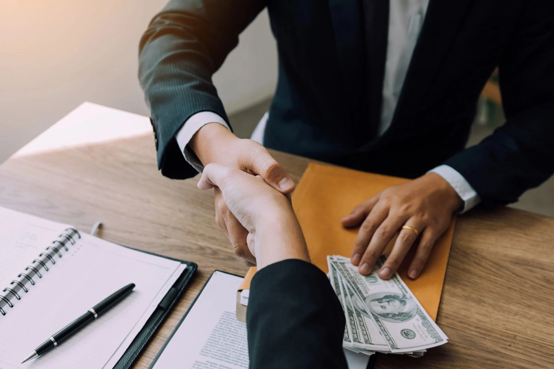 Shaking hands over loan agreement