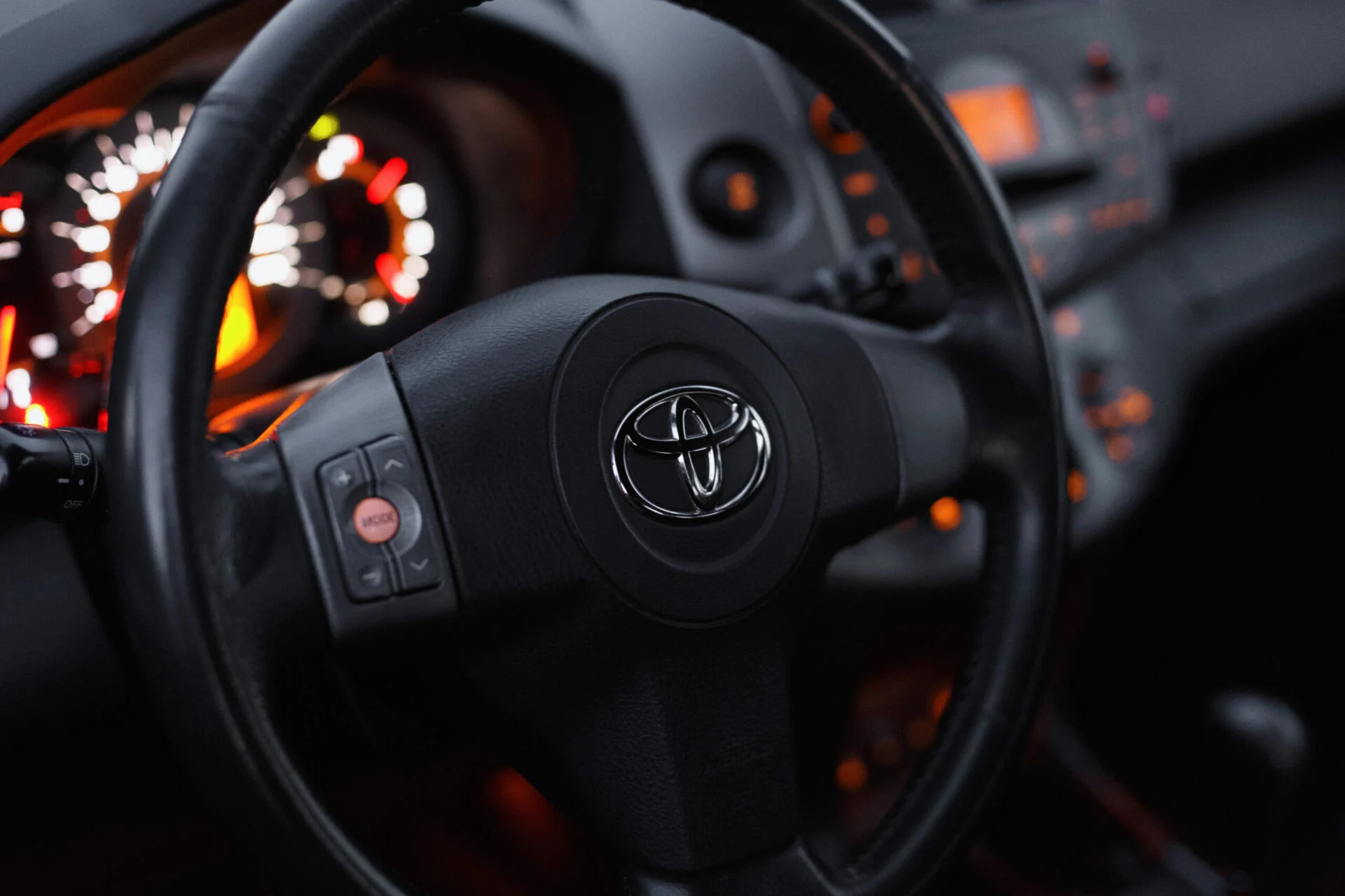Closeup of a steering wheel inside a Toyota vehicle
