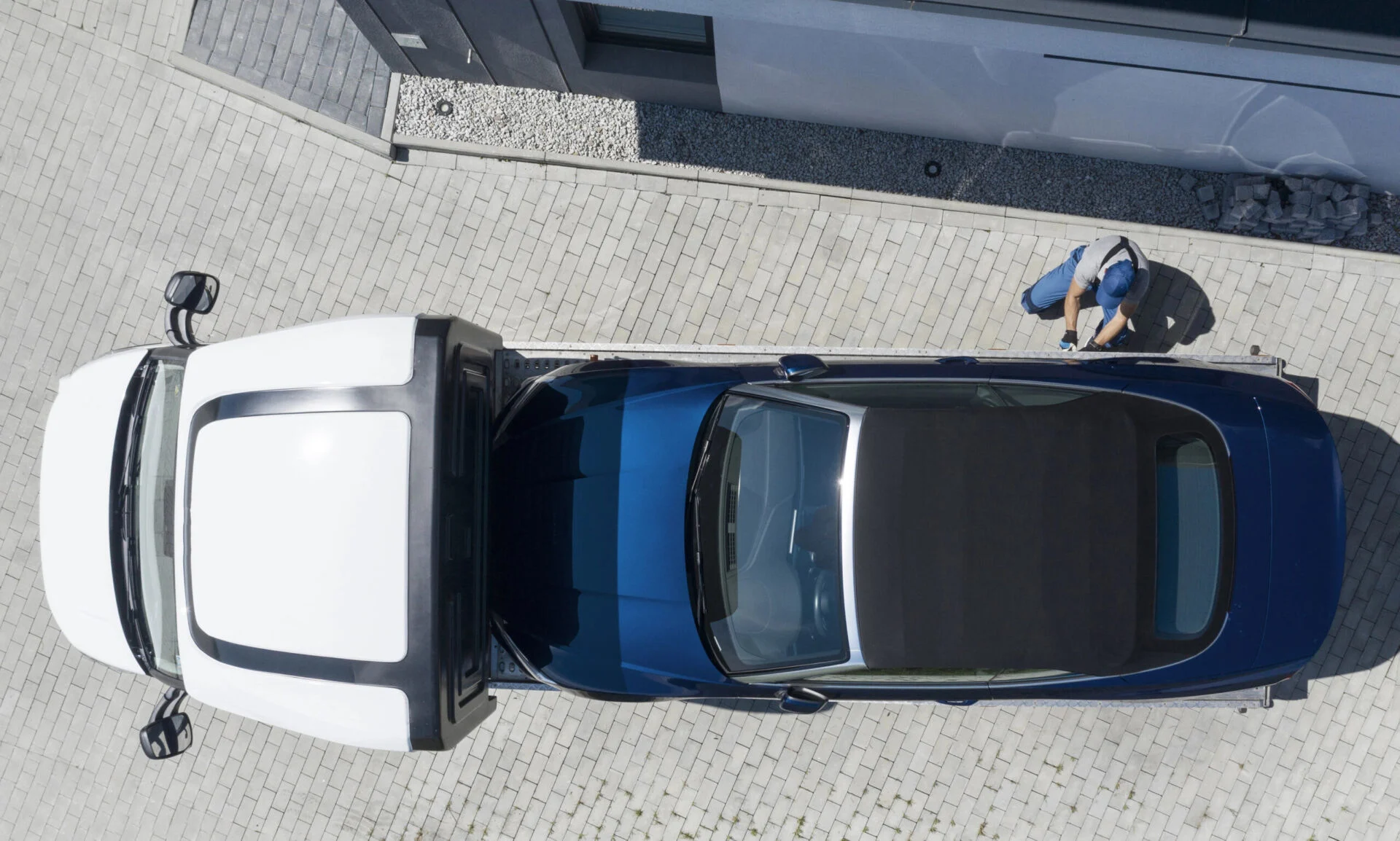 Aerial view of car getting towed