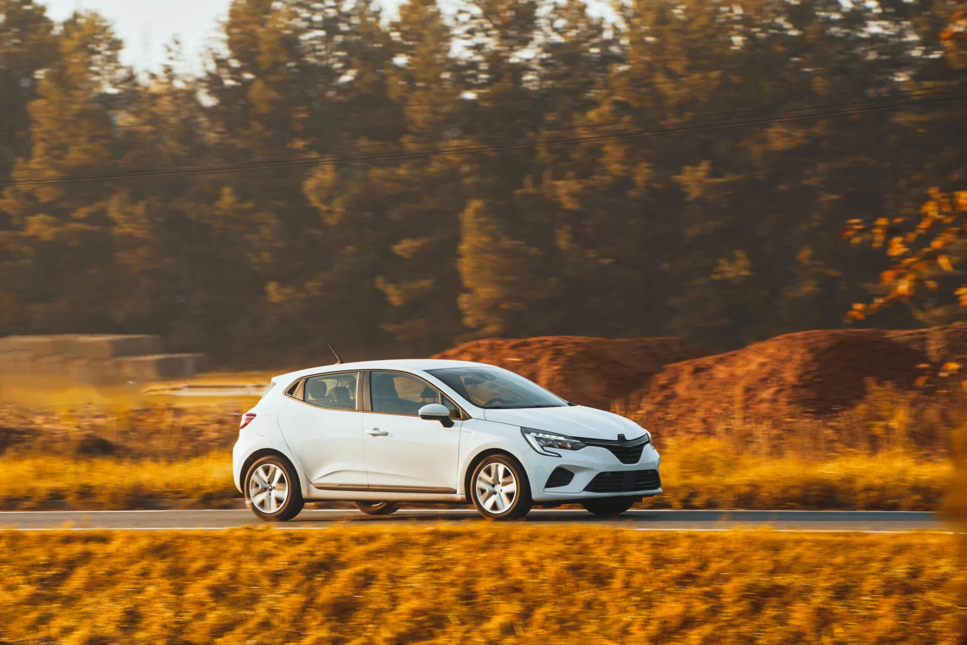 Side view of hatchback driving on the highway.