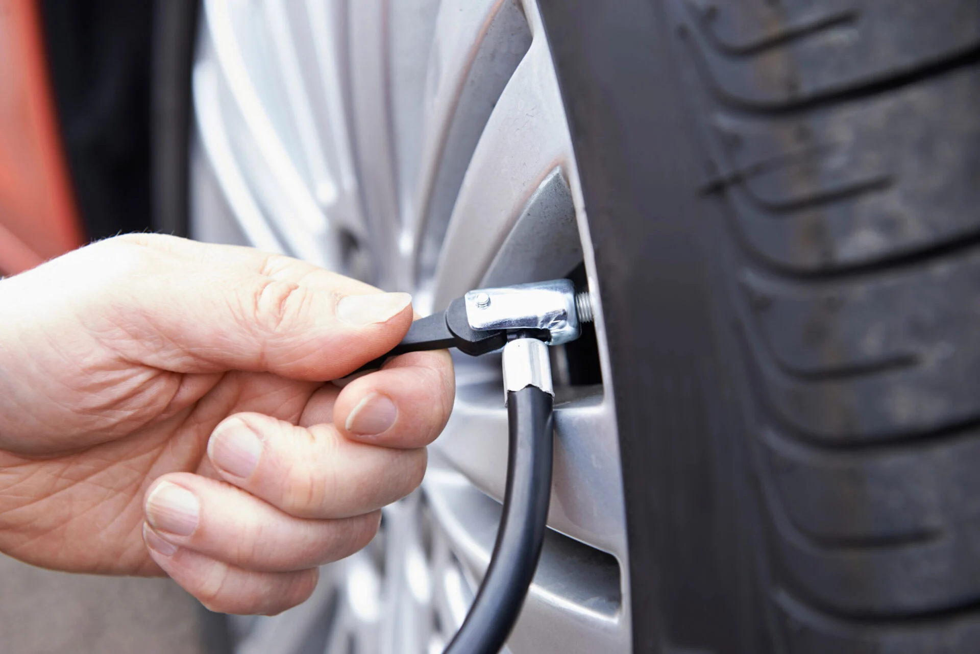Person filling up air in tire